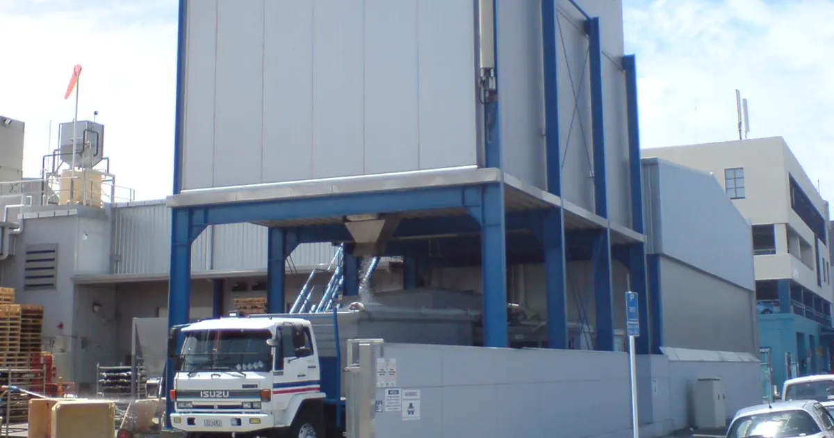 Ice plant and loading bay at a fish market, with a truck receiving ice for chilled seafood